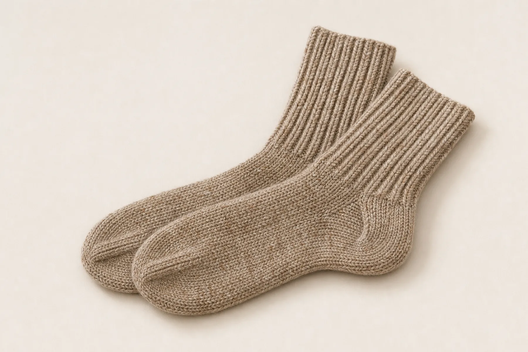 Socks representing a comparison between alpaca fiber and wool